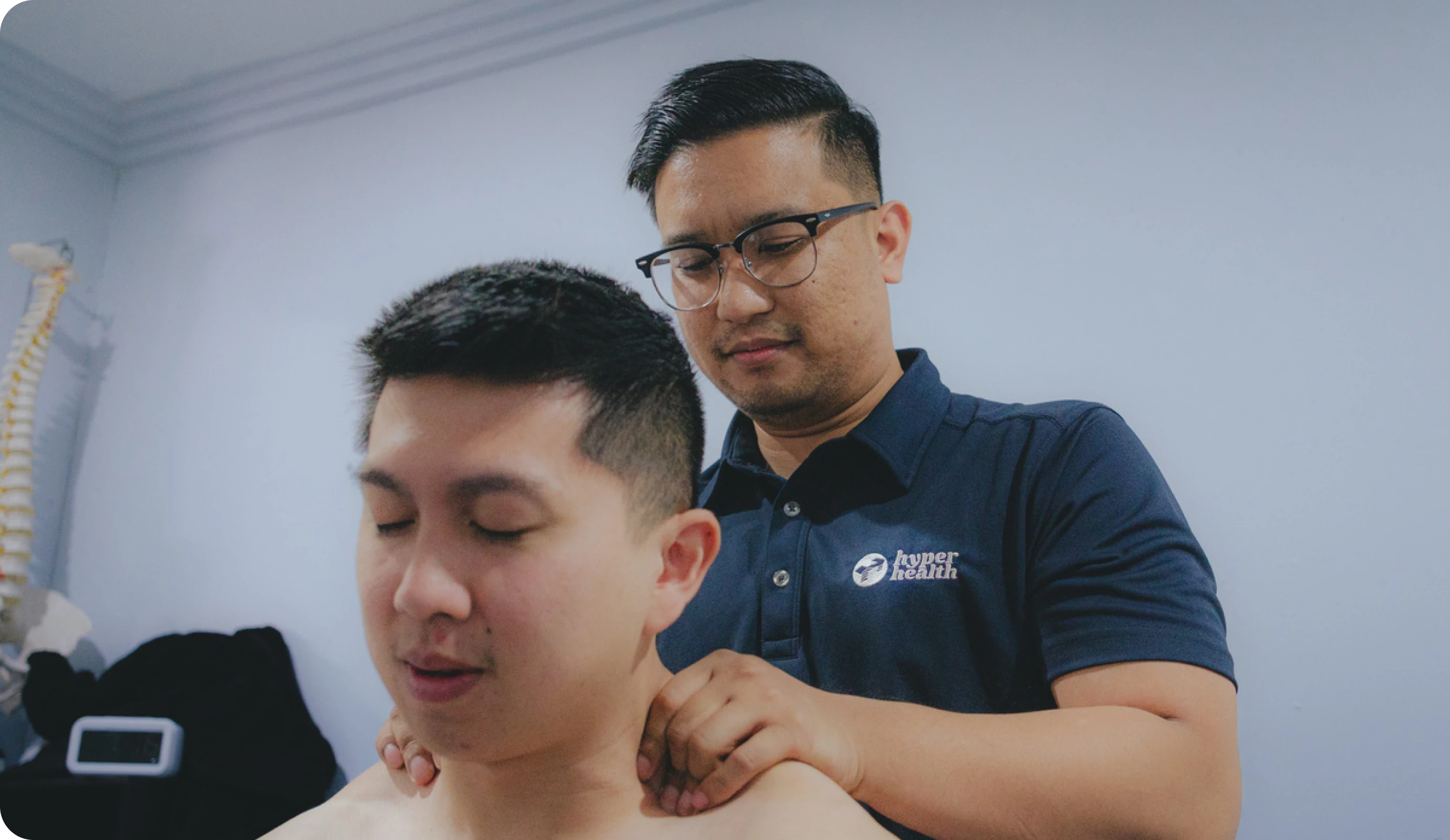 Chiropractor examining a patient's neck