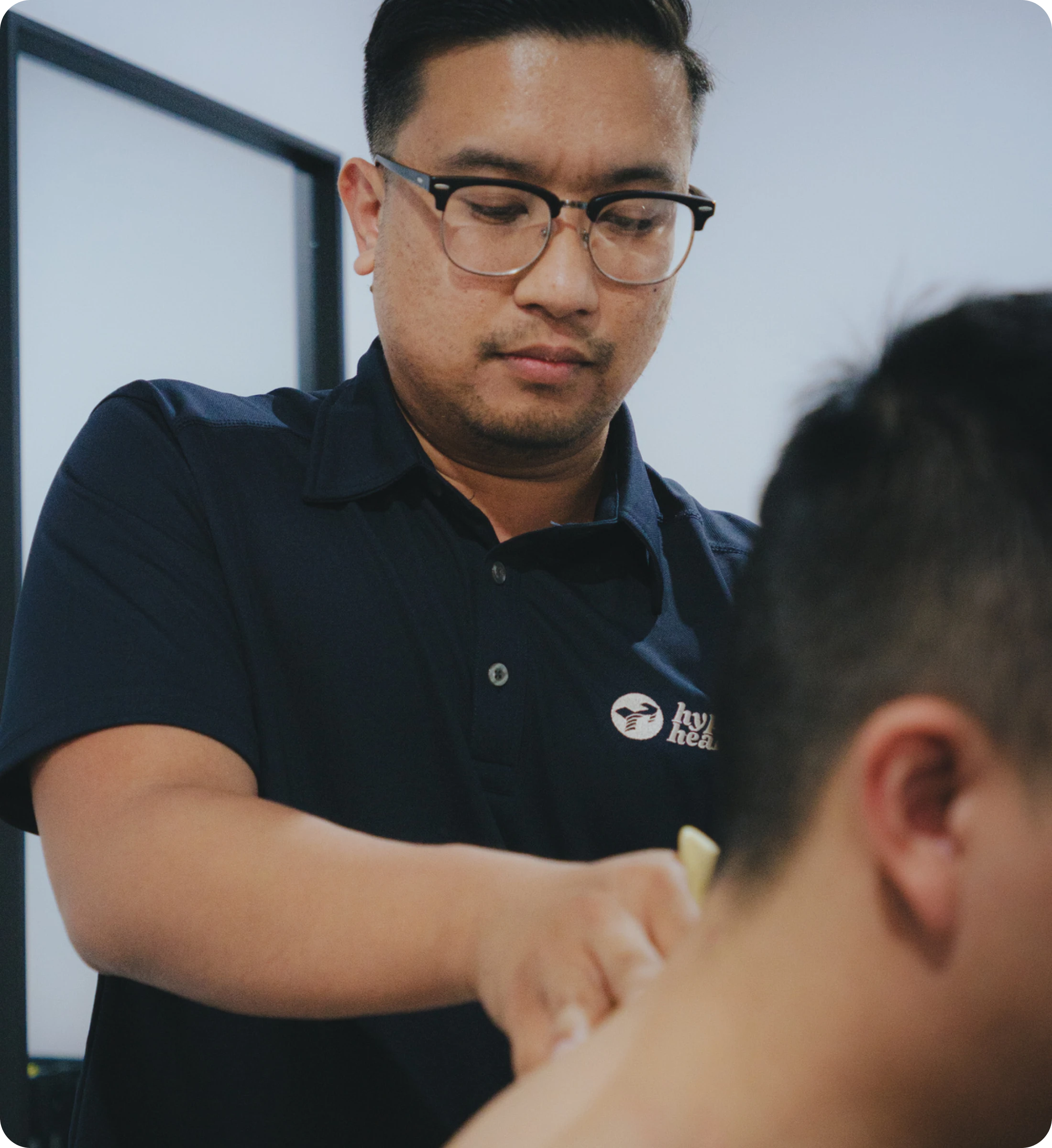 Chiropractor treating a patient at Hyper Health Wetherill Park